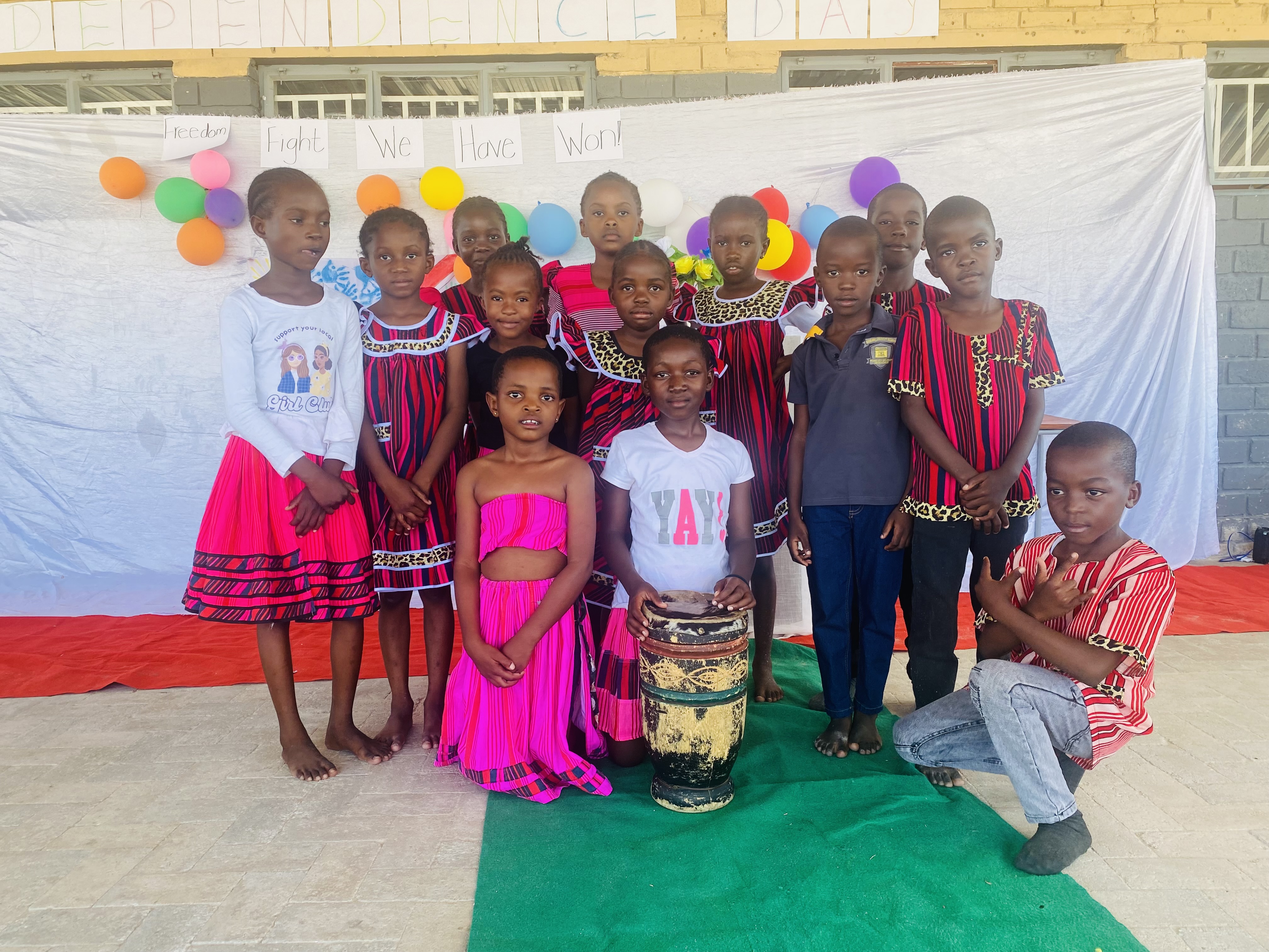 Students celebrating cultural heritage in traditional clothing