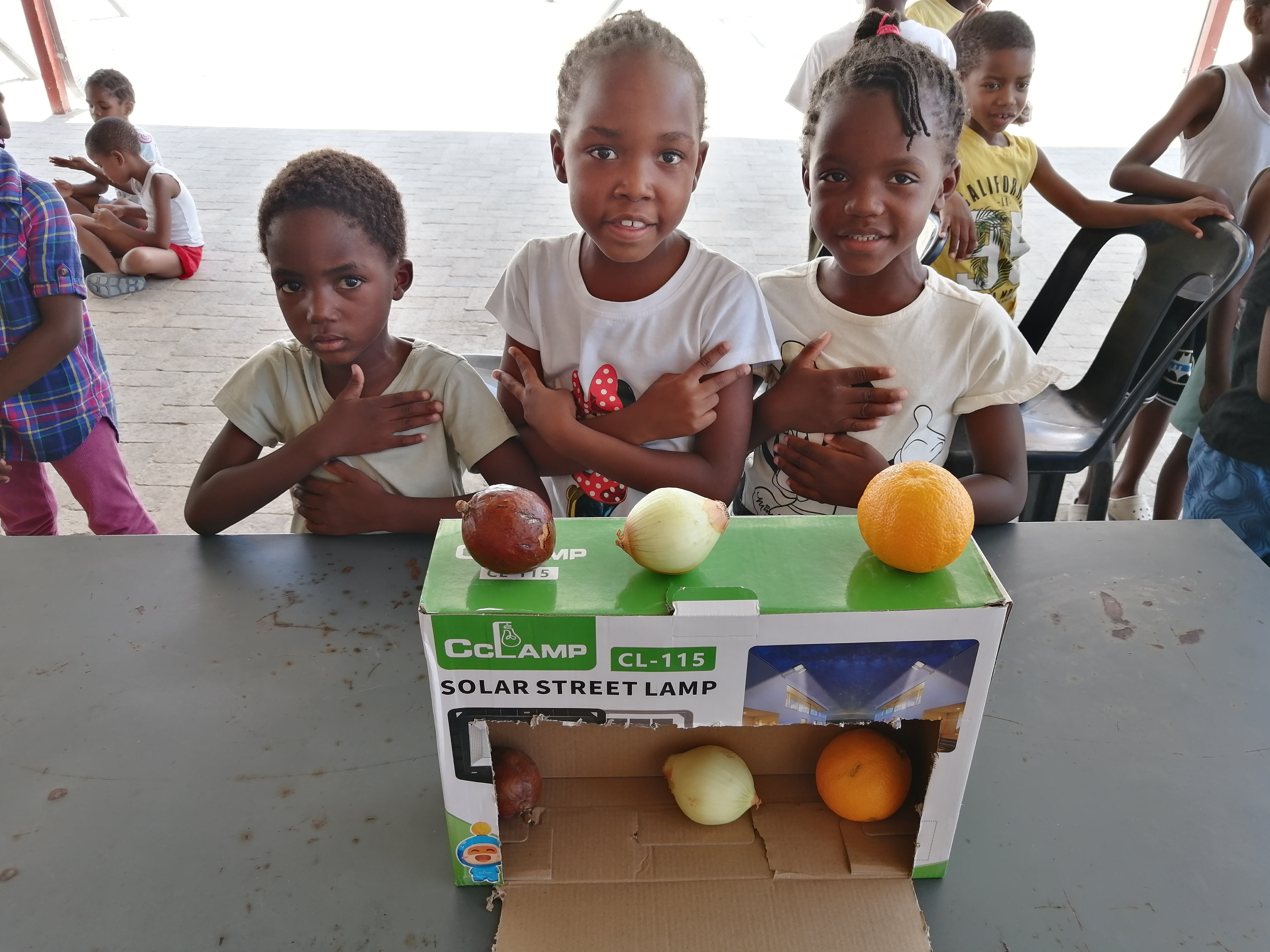 Proud students showcasing their entrepreneurship project
