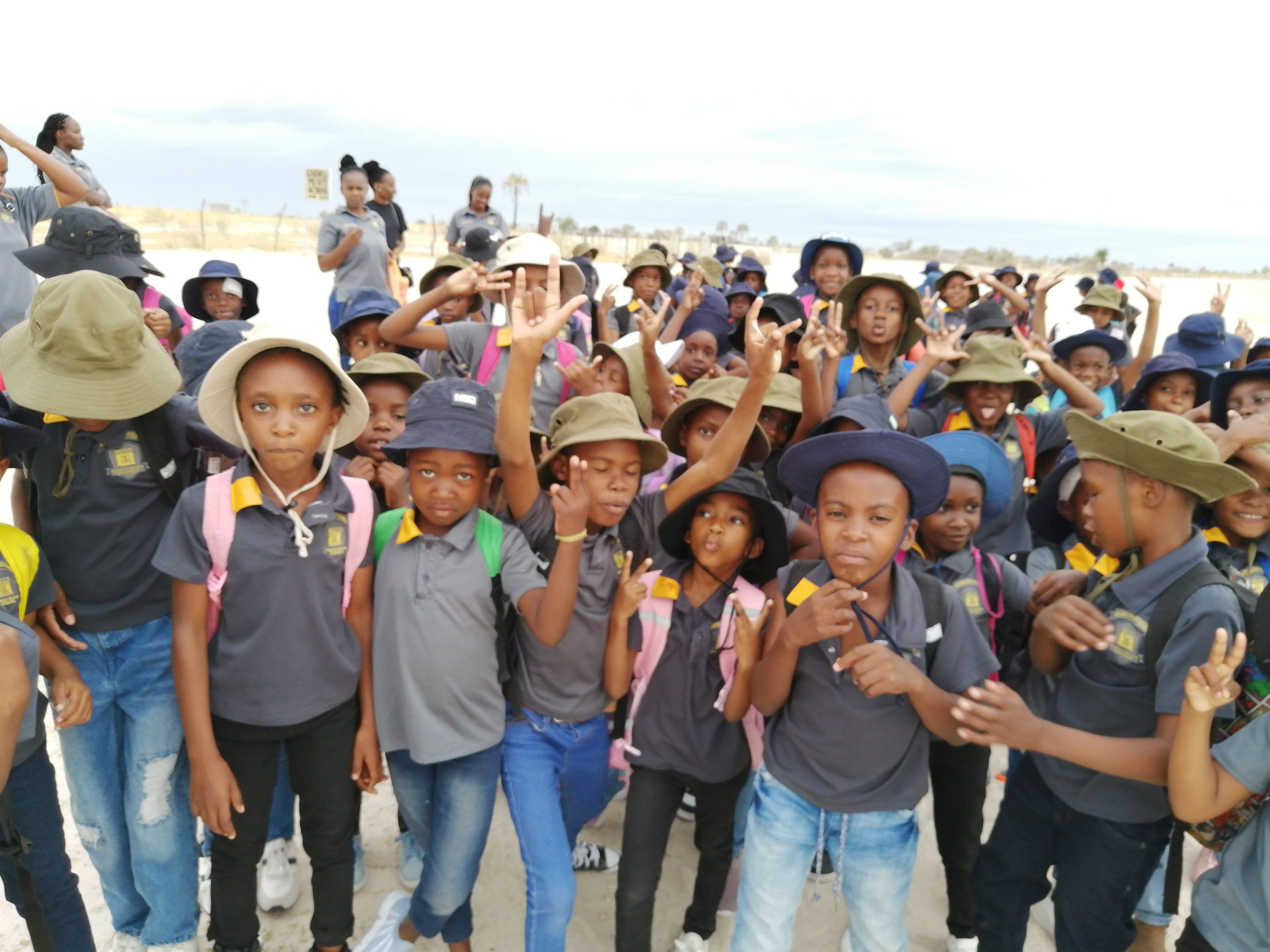 Students waving before water plant visit